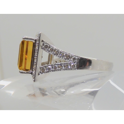 523 - A PLATINUM DIAMOND AND CITRINE DRESS RING