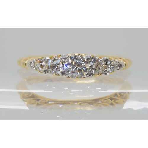 540 - A FIVE STONE DIAMOND RING WITH SCROLLED MOUNT