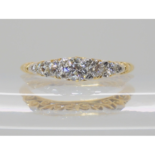 540 - A FIVE STONE DIAMOND RING WITH SCROLLED MOUNT