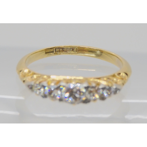 540 - A FIVE STONE DIAMOND RING WITH SCROLLED MOUNT