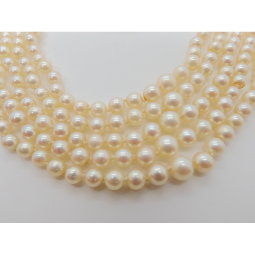 546 - A FIVE STRAND PEARL NECKLACE WITH A 9CT CITRINE AND PEARL CLASP