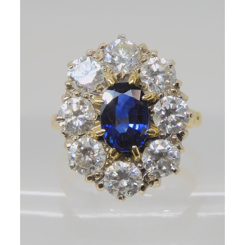 554 - A SUBSTANTIAL SAPPHIRE AND DIAMOND CLUSTER RING