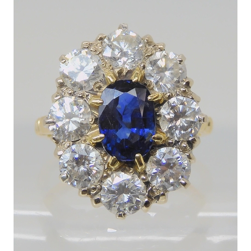 554 - A SUBSTANTIAL SAPPHIRE AND DIAMOND CLUSTER RING