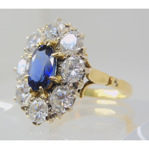 554 - A SUBSTANTIAL SAPPHIRE AND DIAMOND CLUSTER RING