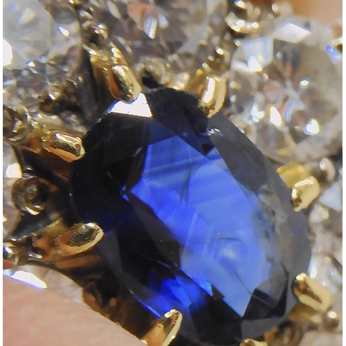 554 - A SUBSTANTIAL SAPPHIRE AND DIAMOND CLUSTER RING