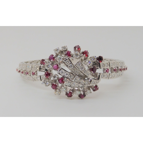 555 - AN 18CT WHITE GOLD RUBY AND DIAMOND BRACELET