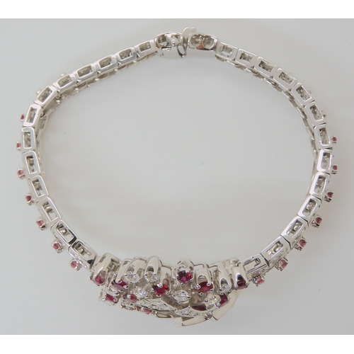 555 - AN 18CT WHITE GOLD RUBY AND DIAMOND BRACELET