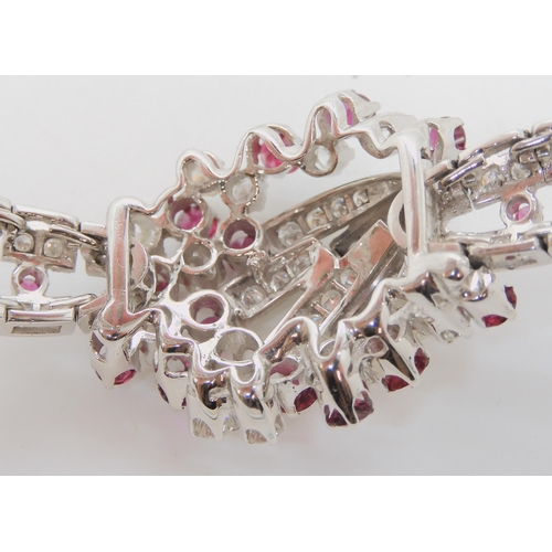 555 - AN 18CT WHITE GOLD RUBY AND DIAMOND BRACELET