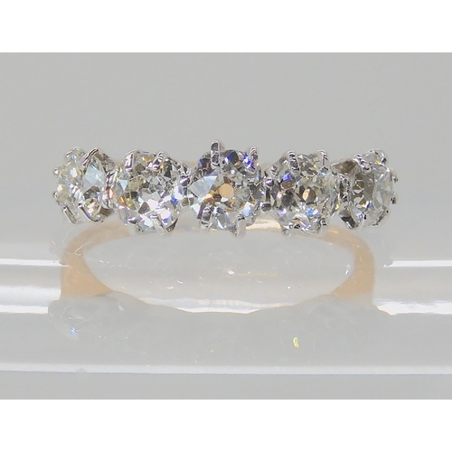 557 - A FIVE STONE DIAMOND RING