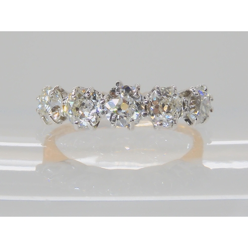 557 - A FIVE STONE DIAMOND RING