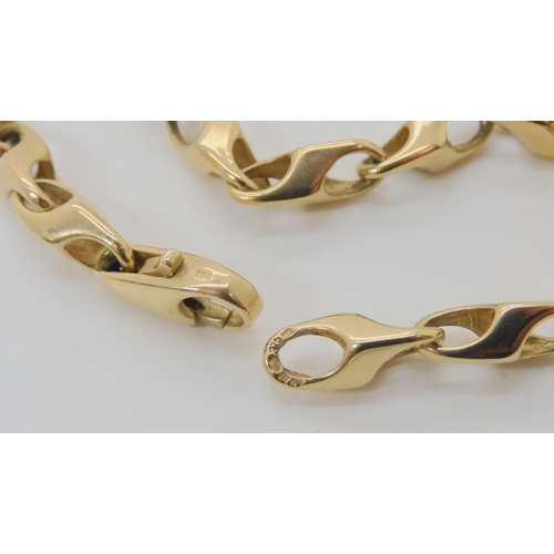 558 - A 9CT GOLD FANCY LINK CHAIN.