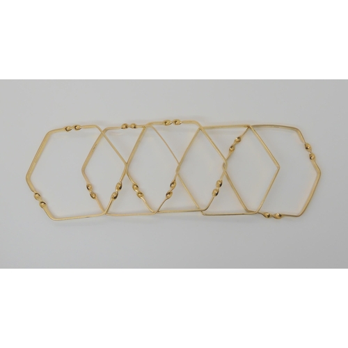 572 - FIVE 9CT GOLD HEXAGONAL SHAPED BANGLES