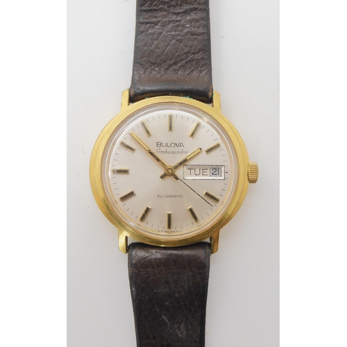 672 - A GOLD PLATED STAINLESS STEEL BULOVA AMBASSADOR AUTOMATIC WATCH