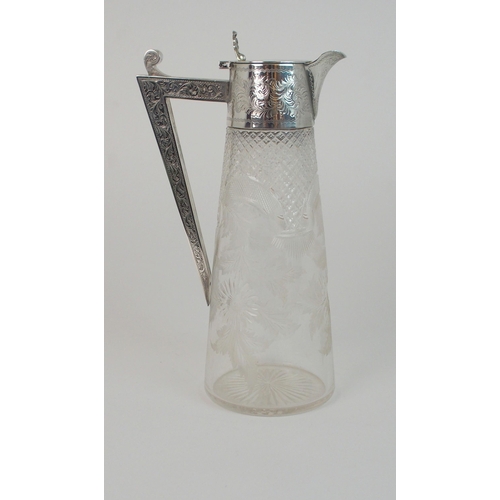 703 - A SILVER MOUNTED CLARET JUG