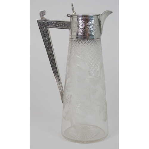 703 - A SILVER MOUNTED CLARET JUG