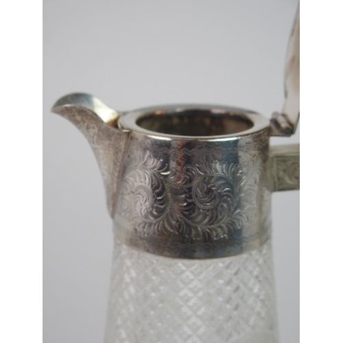 703 - A SILVER MOUNTED CLARET JUG