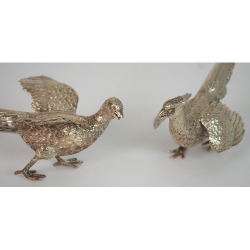 716 - A PAIR OF CONTINENTAL SILVER FIGURES OF COCK AND HEN PHEASANTS