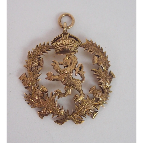 806 - A 9CT GOLD LION RAMPANT PENDANT