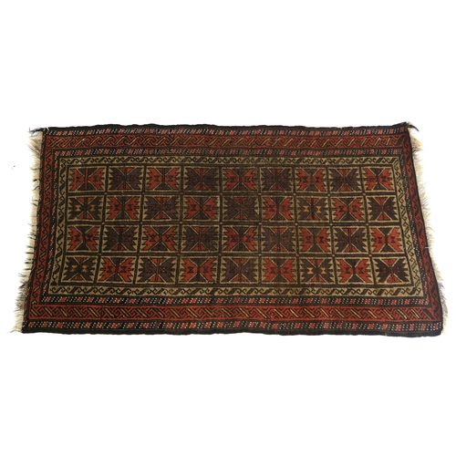 100 - AN EASTERN RUG WITH SMALL MULTI PANELS WITH GEOMETRIC DESIGN