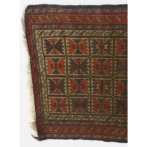 100 - AN EASTERN RUG WITH SMALL MULTI PANELS WITH GEOMETRIC DESIGN