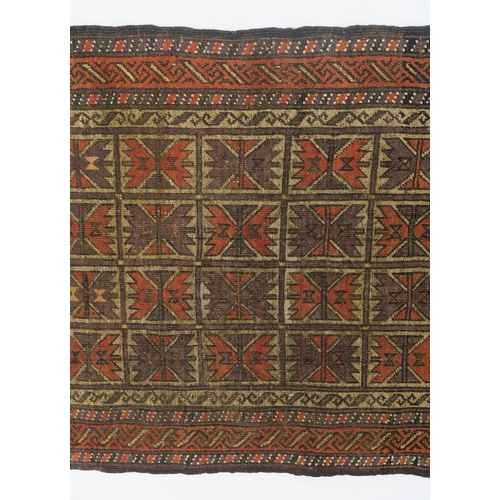 100 - AN EASTERN RUG WITH SMALL MULTI PANELS WITH GEOMETRIC DESIGN