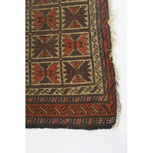 100 - AN EASTERN RUG WITH SMALL MULTI PANELS WITH GEOMETRIC DESIGN