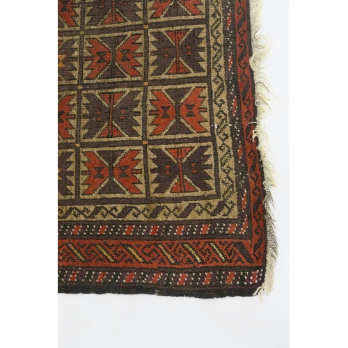 100 - AN EASTERN RUG WITH SMALL MULTI PANELS WITH GEOMETRIC DESIGN