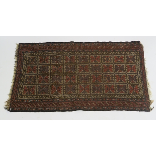 100 - AN EASTERN RUG WITH SMALL MULTI PANELS WITH GEOMETRIC DESIGN