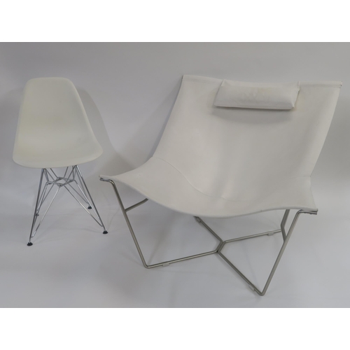 107 - A WHITE LEATHER LOUNGE CHAIR ON STEEL BASE