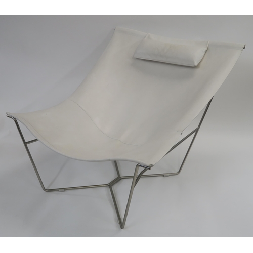 107 - A WHITE LEATHER LOUNGE CHAIR ON STEEL BASE