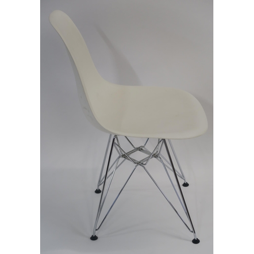 107 - A WHITE LEATHER LOUNGE CHAIR ON STEEL BASE