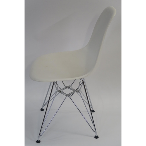 107 - A WHITE LEATHER LOUNGE CHAIR ON STEEL BASE