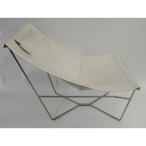 107 - A WHITE LEATHER LOUNGE CHAIR ON STEEL BASE