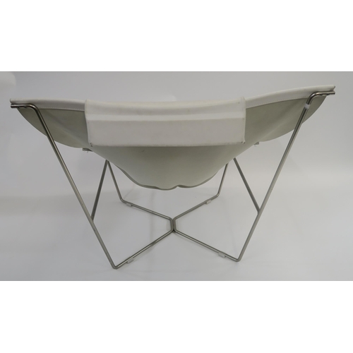 107 - A WHITE LEATHER LOUNGE CHAIR ON STEEL BASE