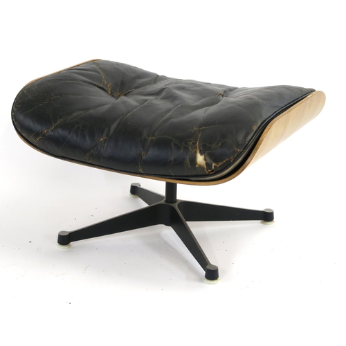 120 - A RAY AND CHARLES EAMES ROSEWOOD VENEERED PLYWOOD LOUNGE CHAIR 78cm high WITH MATCHING STOOL with or... 
