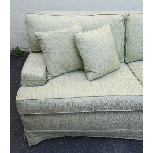 125 - A PETER DUDGEON LARGE GREEN UPHOLSTERED SOFA