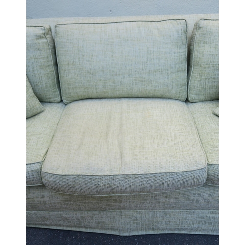 125 - A PETER DUDGEON LARGE GREEN UPHOLSTERED SOFA