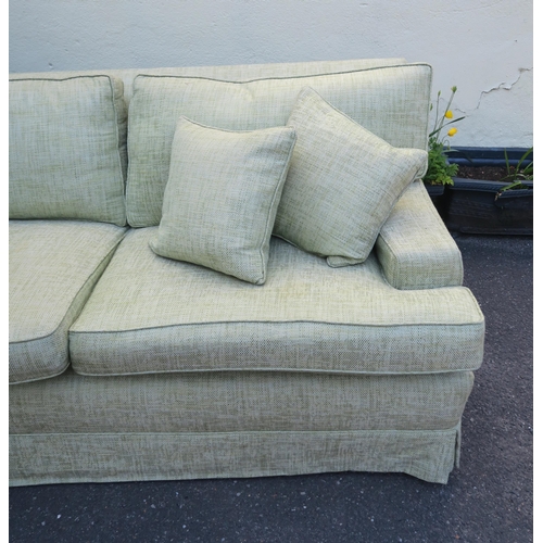 125 - A PETER DUDGEON LARGE GREEN UPHOLSTERED SOFA