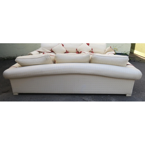 127 - A LARGE CREAM HUMPBACK SOFA