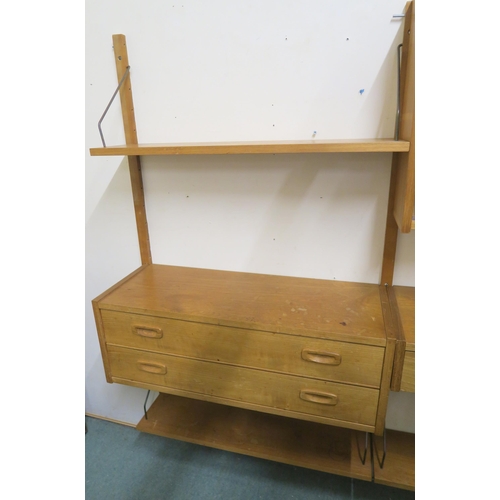 135 - A SET OF POUL CADVIOUS TEAK WALL SHELVING WITH THREE UPRIGHTS  OPEN SHELVES  DRAWERS AND CABINET WIT... 