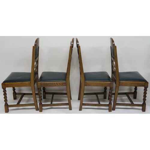 23 - AN EARLY 20TH CENTURY OAK DINING ROOM SUITE