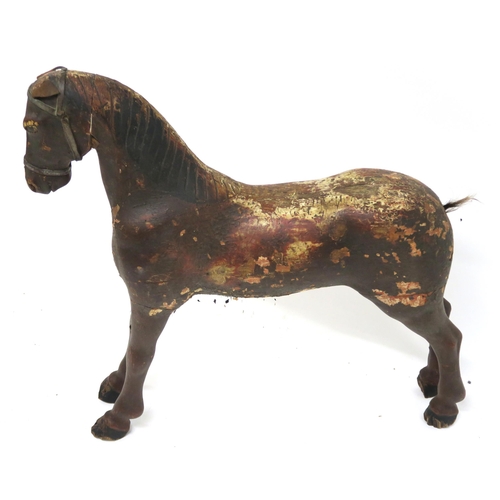55 - A PRIMITIVE PAINTED MODEL OF A HORSE