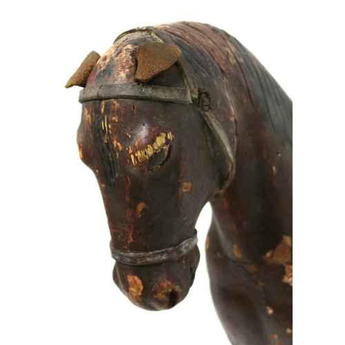 55 - A PRIMITIVE PAINTED MODEL OF A HORSE