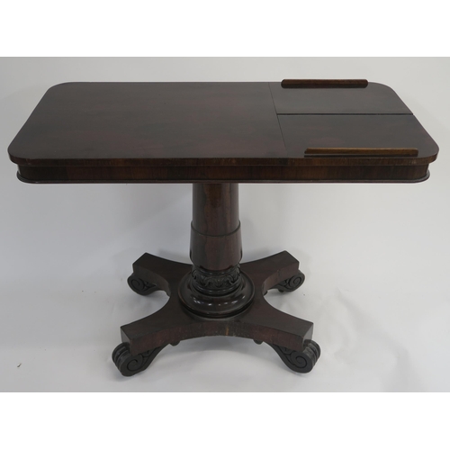6 - A VICTORIAN ROSEWOOD LIBRARY TABLE the rectangular top set with twin hinged reading slopes and on gu... 