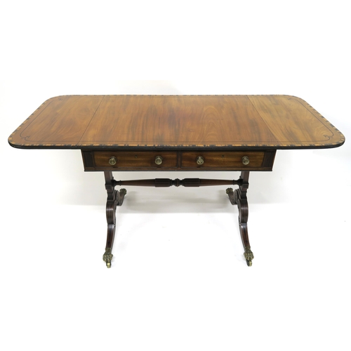 65 - A MAHOGANY AND CROSSBANDED SOFA TABLE