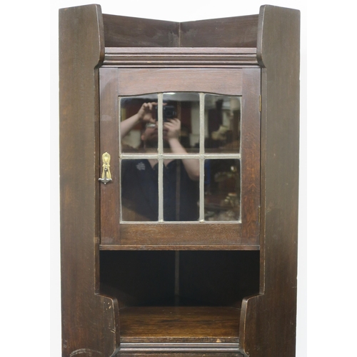 71 - A LIBERTY & CO OAK CORNER CABINET OF ARCHITECTURAL FORM