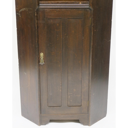 71 - A LIBERTY & CO OAK CORNER CABINET OF ARCHITECTURAL FORM