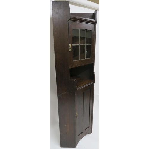 71 - A LIBERTY & CO OAK CORNER CABINET OF ARCHITECTURAL FORM