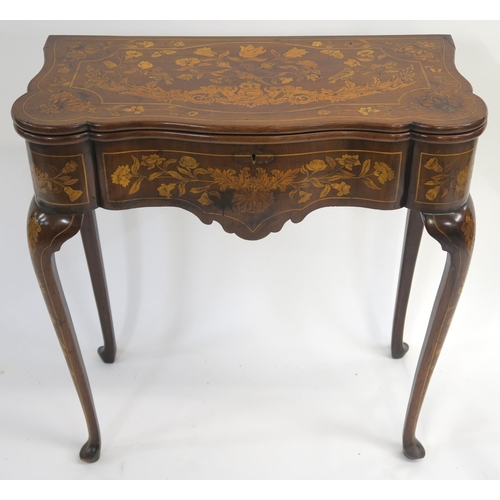 8 - A DUTCH ROSEWOOD AND MARQUETRY CARD TABLE the twin hinged top inlaid with cherubs birds and foliage ... 