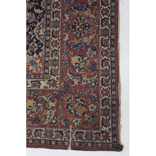 85 - A SIGNED CREAM GROUND ISFAHAN RUG WITH CENTRAL MEDALLION